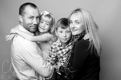Black and white image of family of four