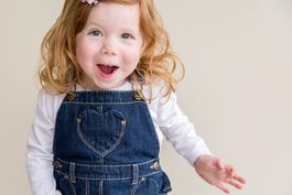 photograph of happy girl jumping